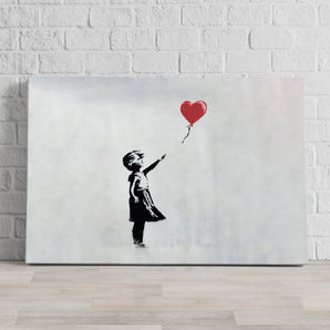 Leinwandbild - Kind mit rotem Ballon