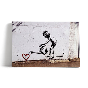 Leinwandbild - Kind mit Giesskanne