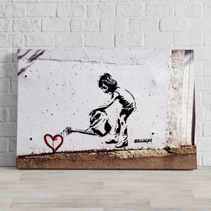 Leinwandbild - Kind mit Giesskanne